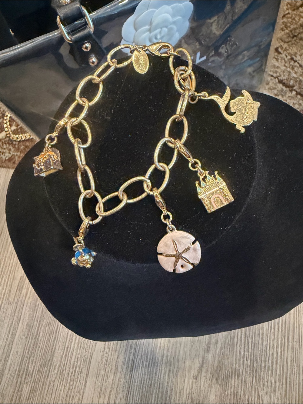 Disney Gold-Tone Charm Bracelet with Sand Dollar, Castle & Teapot Charms